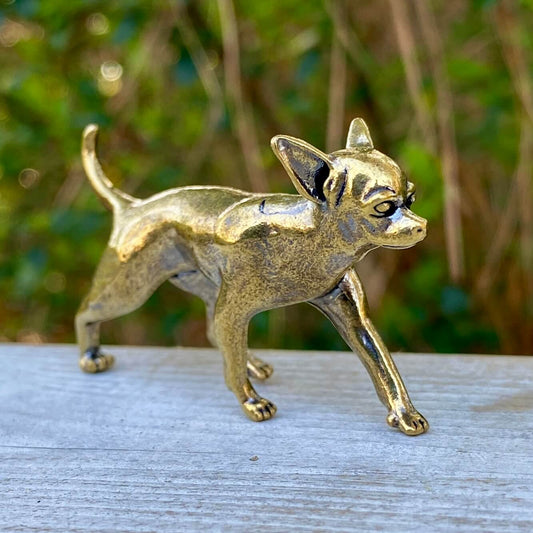 Solid brass Chihuahua dog figurine by Wild Brass, symbolizing loyalty, energy, and courage, detailed and polished surface.
