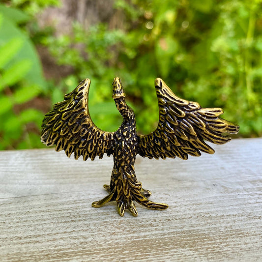 Capture the power of transformation with this handmade brass phoenix. A meaningful piece symbolizing rebirth and rising from the ashes.