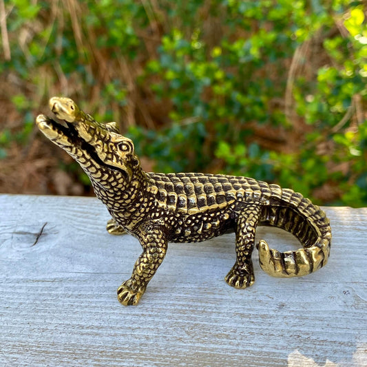 Solid brass alligator sculpture by Wild Brass, showcasing primal power and instinct with detailed craftsmanship.